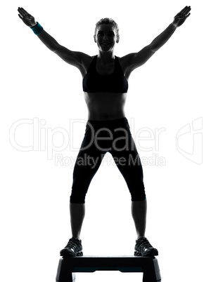 woman exercising step aerobics.