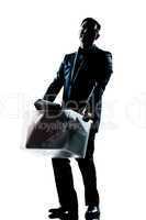 silhouette man full length fired carrying heavy box