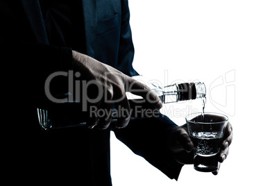 silhouette man hands close up pouring white alcohol