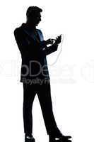 silhouette man full length text messaging telephone listening to