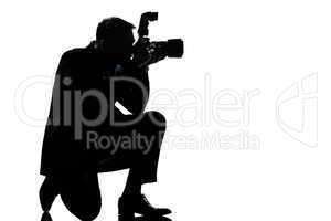 silhouette man kneeling photographer