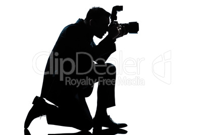 silhouette man kneeling photographer