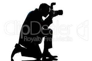 silhouette man kneeling photographer