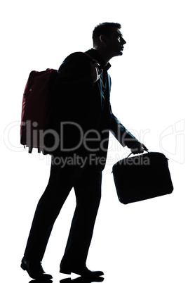 business traveler man walking with suitcase  on shoulders