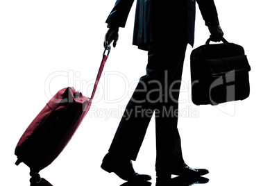 business traveler man walking with handbag and  suitcase