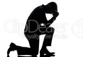 silhouette man kneeling sadness praying full length