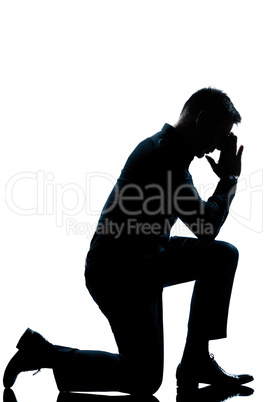 silhouette man kneeling full length