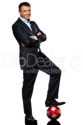 one business man standing  foot on soccer ball