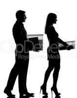 one couple man and woman walking carrying boxes happy