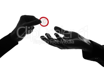 couple man and woman hands holding giving condom close up