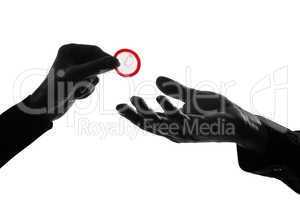 couple man and woman hands holding giving condom close up