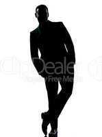 one business man standing Full length hands in pocket silhouette