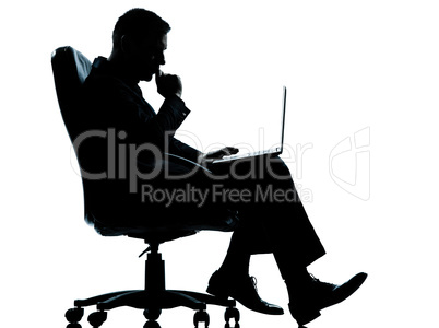 one business man computer computing serious sitting in armchair