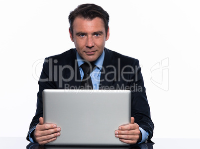 business man holding  laptop computer looking at camera