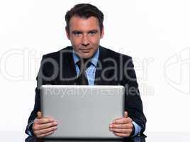 business man holding  laptop computer looking at camera