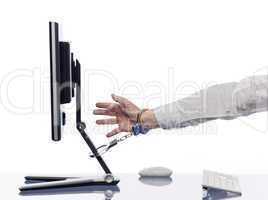Hand chained to computer with handcuffs