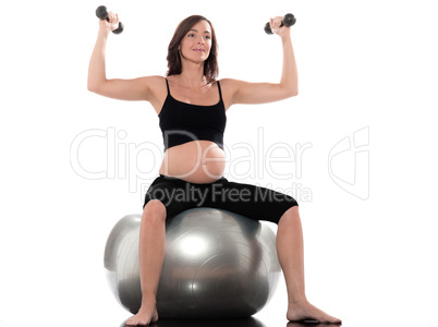 Pregnant Woman Workout weight training sitting on fitness ball