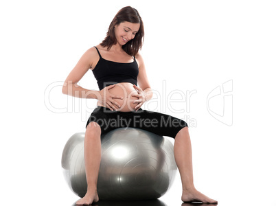 Pregnant Woman Happy sitting on swiss ball fitness