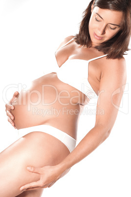 Pregnant woman pinching cellulite