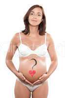 Pregnant woman with heart drawn on the belly