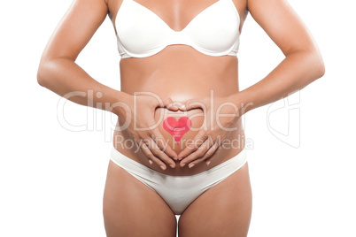 Pregnant woman with heart drawn on the belly