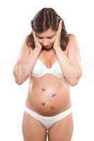 Pregnant woman stress anxious with butterfly in the stomach