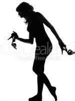 silhouette woman walking quite barefoot on tiptoe