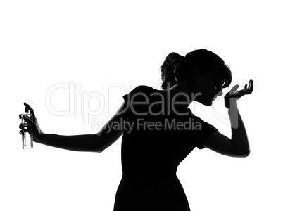 silhouette woman smelling perfume