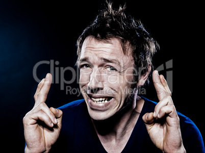 Funny Man Portrait with crossed fingers