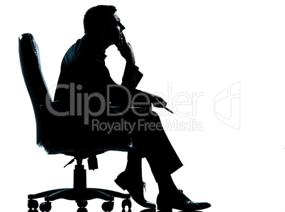 one business man sitting in armchair silhouette