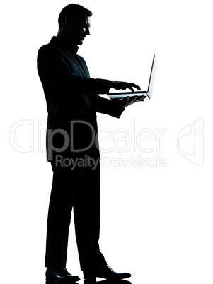 one business man silhouette computing computer laptop