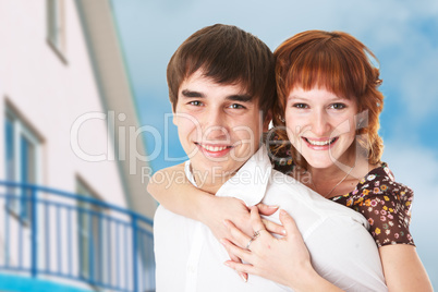 happy young couple and home