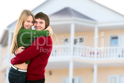 happy young couple and home