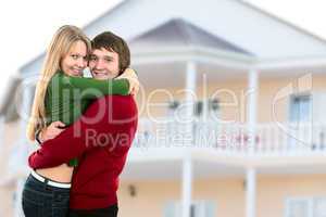 happy young couple and home