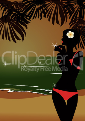 Girl`s silhouette on sunset tropic beach