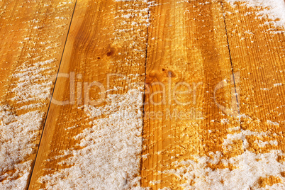 Wooden shield covered with snow