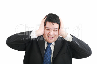 Frustrated young businessman pulling his hair, studio shot