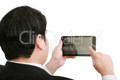 Businessman holding a blank touchpad pc, one finger touches the