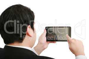 Businessman holding a blank touchpad pc, one finger touches the