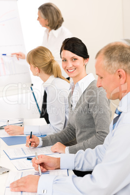 Giving presentation young woman during meeting