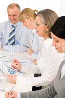 Business meeting team examining sales report