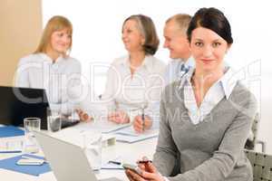 Young executive woman use phone during meeting