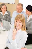 Businesswoman at team meeting with colleagues