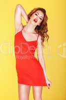 Slender young girl in red dress
