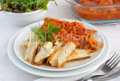 Baked fish in tomato sauce with vegetables