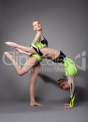 Two acrobats demonstrate skill
