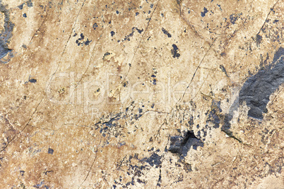 stone rock with cracks in the background