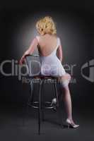 Sexy gold blond woman sit on chair