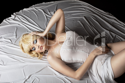 gorgeous sensuality woman lay on fashion cloth