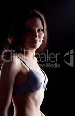 sexy young woman lingerie portrait in dark
